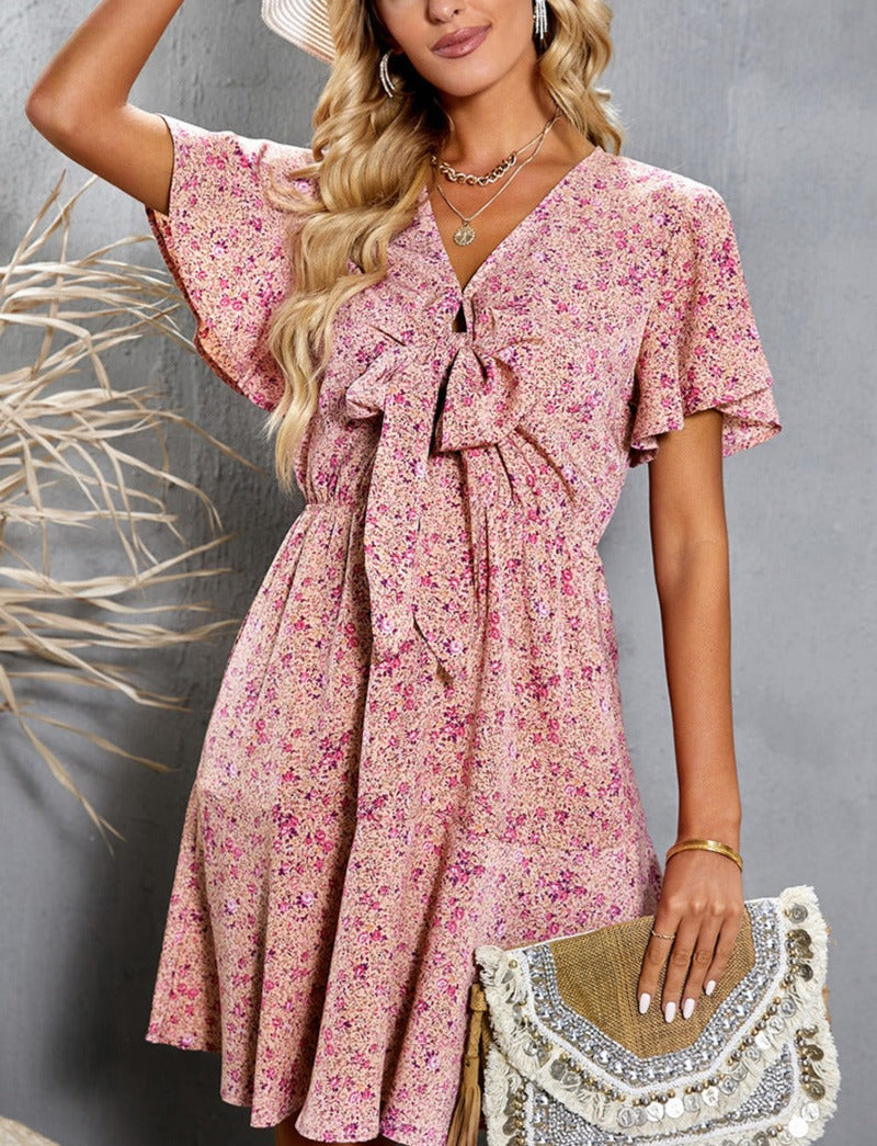 Elegant V-neck Dress with Floral Print and Lace-up Detailing.