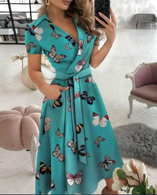 Hot selling spring/summer fashionable long sleeved V-neck printed buttocks wrapped dress for women