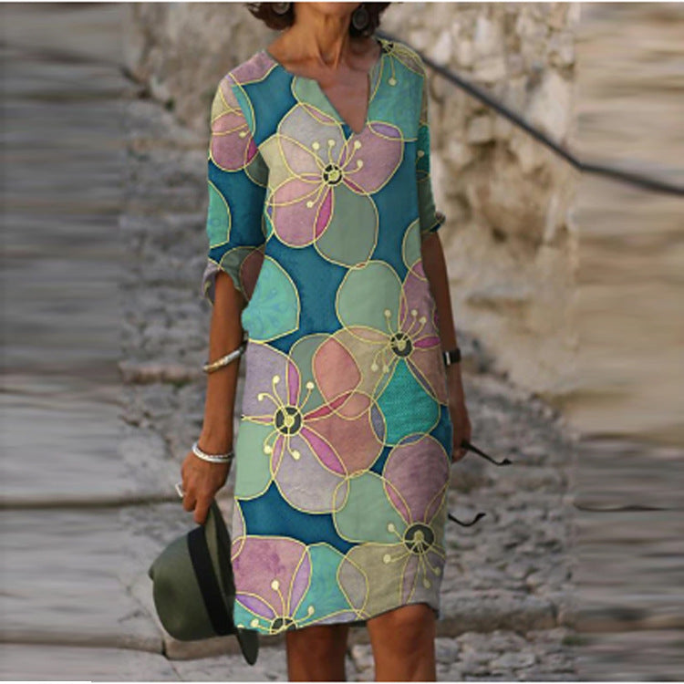 Long Sleeve Women's Dress with a Multicolor Printed Skirt.