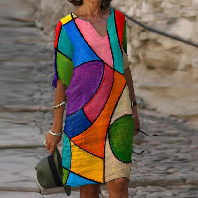 Long Sleeve Women's Dress with a Multicolor Printed Skirt.