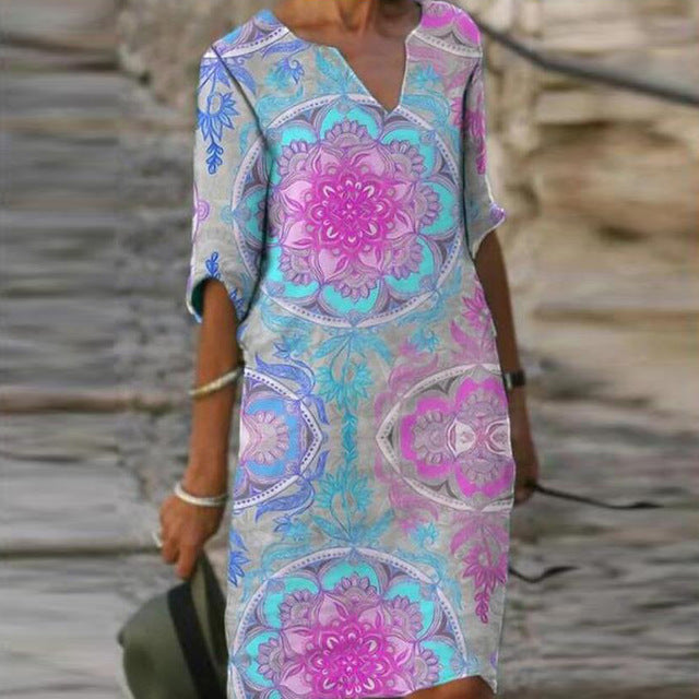 Long Sleeve Women's Dress with a Multicolor Printed Skirt.