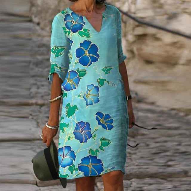 Long Sleeve Women's Dress with a Multicolor Printed Skirt.